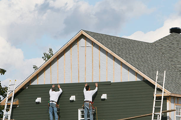 Professional Storm Damage Siding Repair technician working in Zebulon, NC